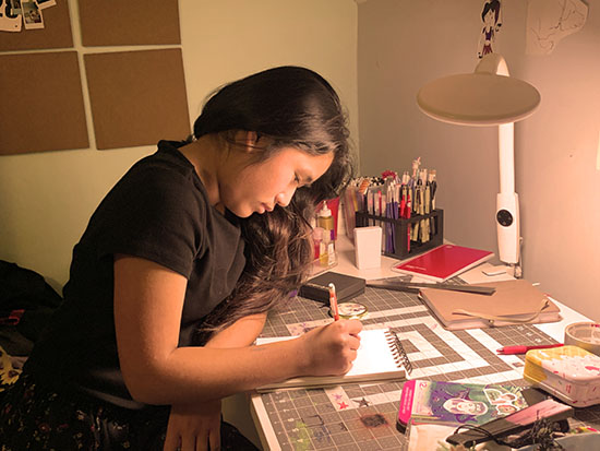 beatrice creating art at desk iimage